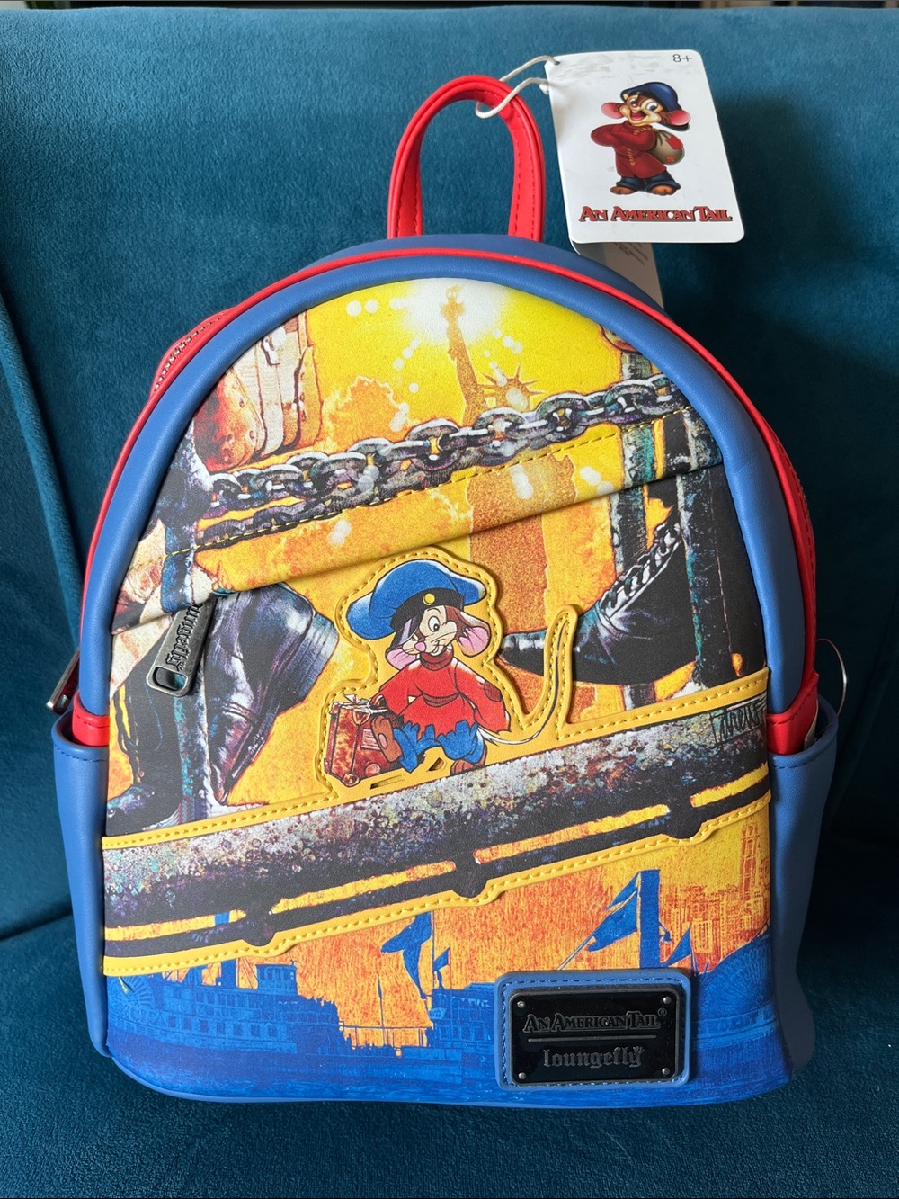 An American Tail Loungefly Blue, Red & Yellow Mini Backpack with Character Patch